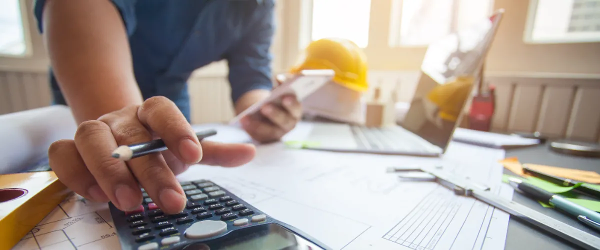 A contractor working on budgeting and costs
